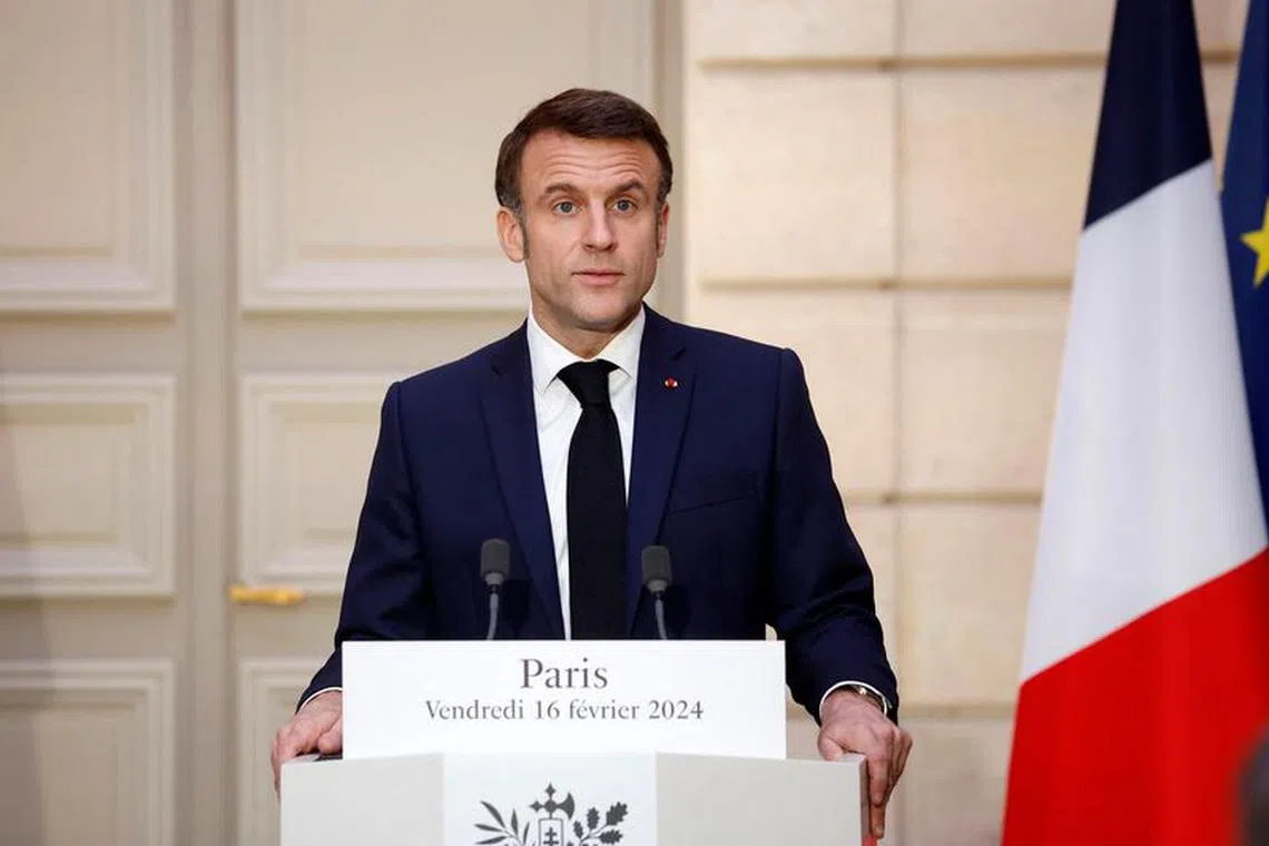 French President Emmanuel Macron speaks while making a joint statement with King of Jordan Abdullah II at the Elysee Palace in Paris, France, 16 February 2024.   YOAN VALAT/Pool via REUTERS