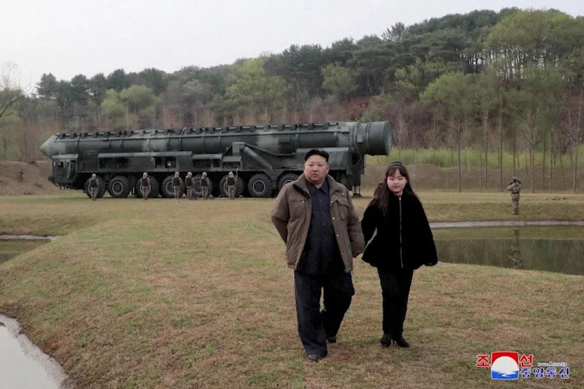 North Korean leader Kim Jong Un and his daughter Kim Ju Ae attend a test launch of a new solid-fuel intercontinental ballistic missile Hwasong-18 at an undisclosed location, on April 14. 