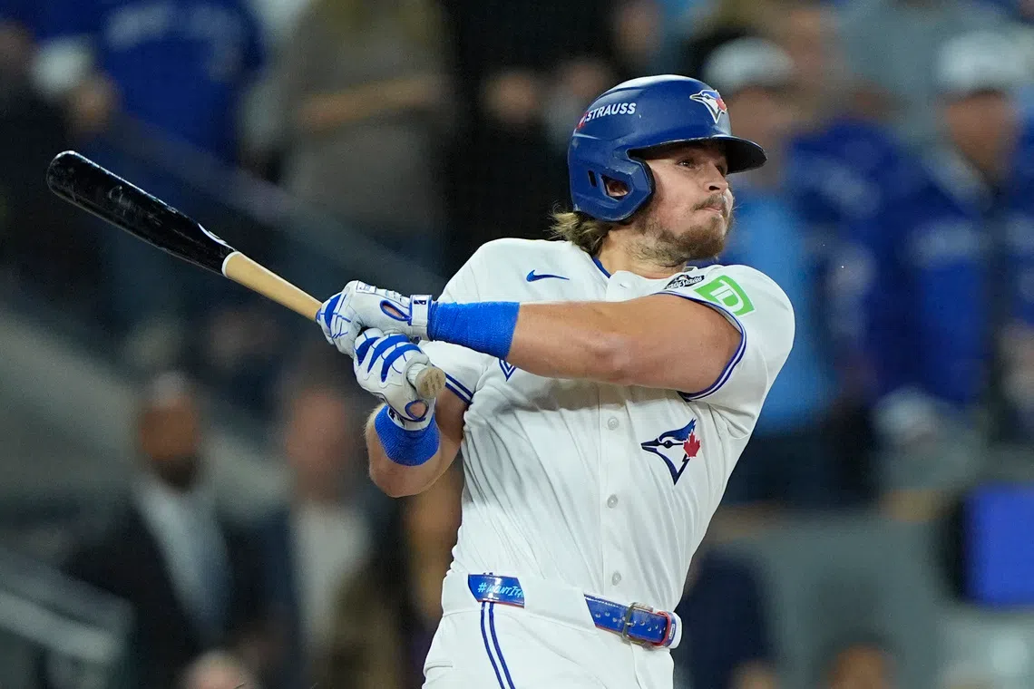 Nov 1, 2025; Toronto, Ontario, CAN; Toronto Blue Jays third baseman Addison Barger (47) hits a single against the Los Angeles Dodgers in the second inning during game seven of the 2025 MLB World Series at Rogers Centre. Mandatory Credit: John E. Sokolowski-Imagn Images