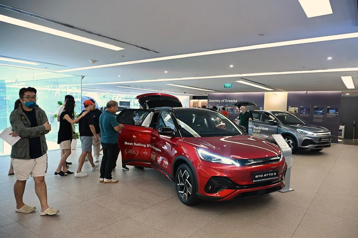 Customers looking at cars in BYD car Showroom along Alexandra Road on 6 January. 2024. 
Crowds are expected at car showrooms following the big drop in certificate of entitlement premiums on Wednesday and lowered car prices ahead of the Singapore Motorshow.