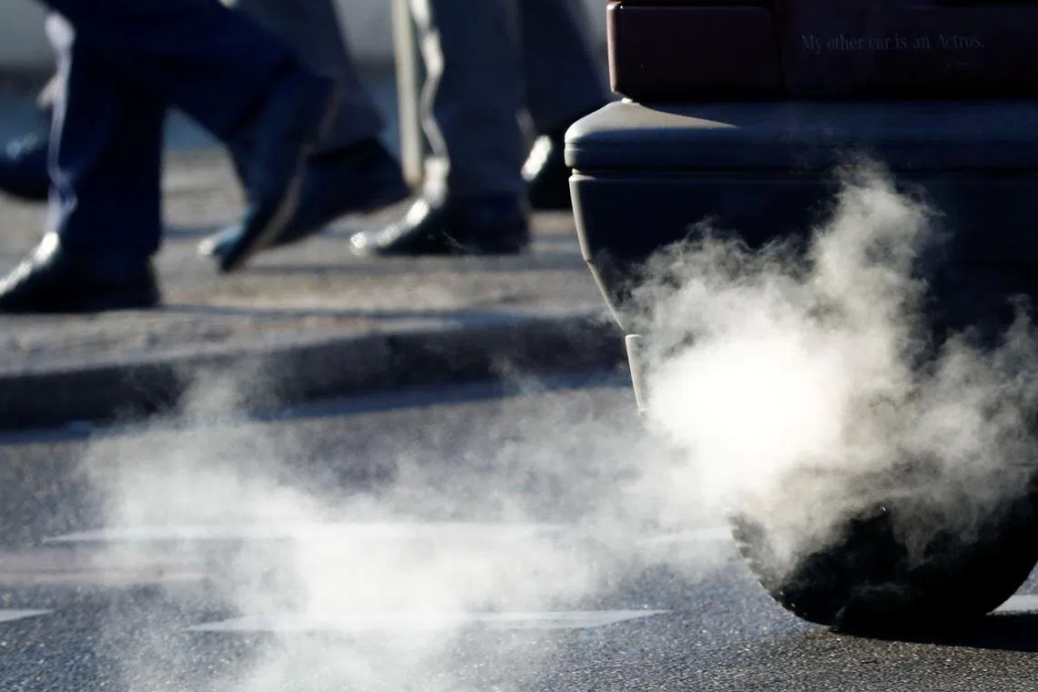 FILE PHOTO: An exhaust pipe of a car is pictured on a street in a Berlin, Germany, February 22, 2018. REUTERS/Fabrizio Bensch/File Photo