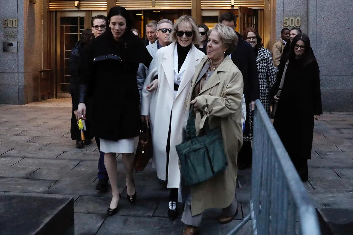 epa11107086 Journalist E. Jean Carroll  (C) exits court after being awarded US$83.3 million US dollars in damages for defamation by former president Donald Trump