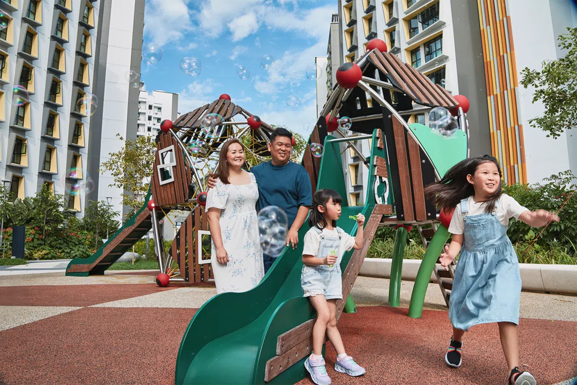Tampines GreenGem resident Jason Lim with his wife, Esther Chan, and their daughters.