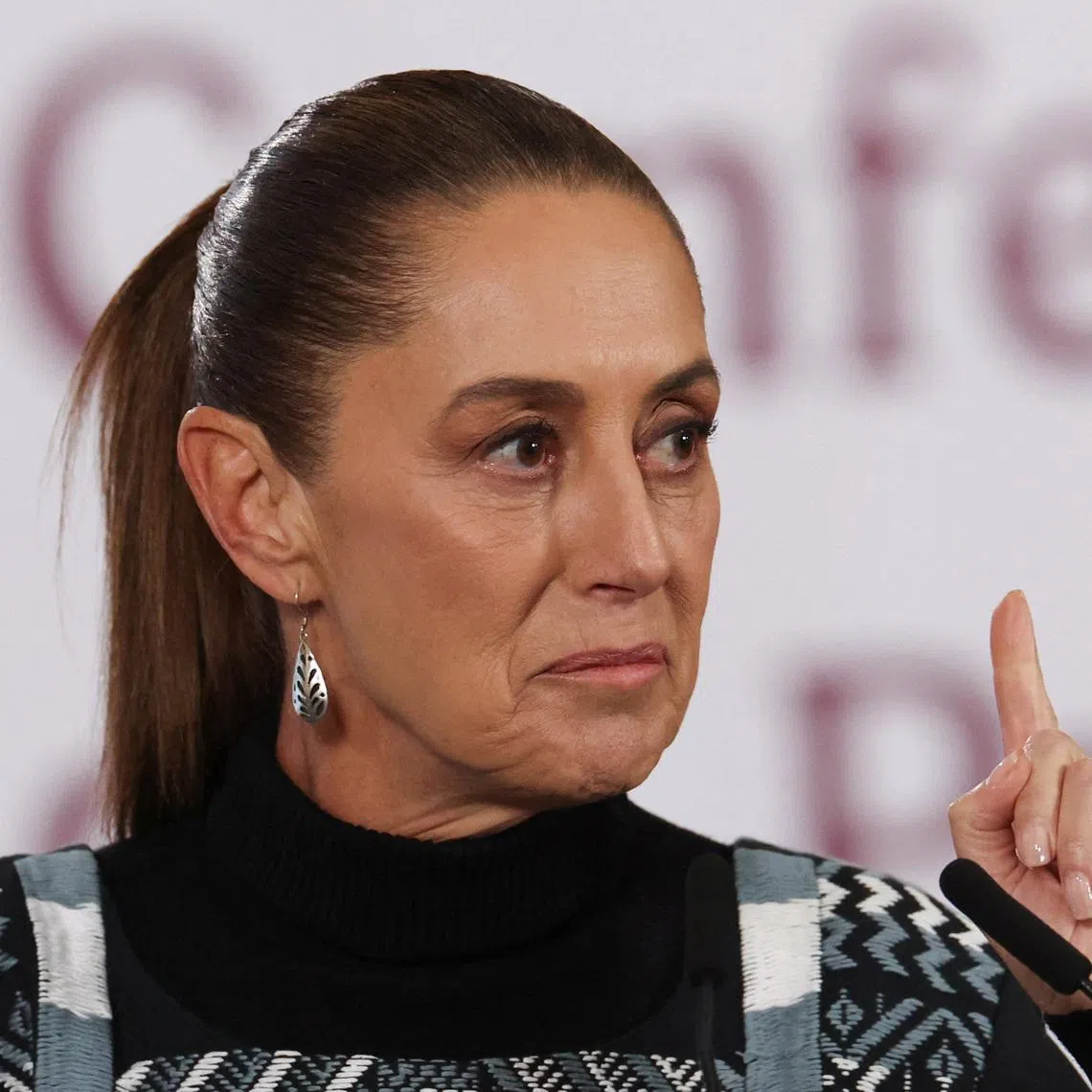 Mexican President Claudia Sheinbaum gestures during a press conference at the National Palace in Mexico City, Mexico January 27, 2026. REUTERS/Henry Romero