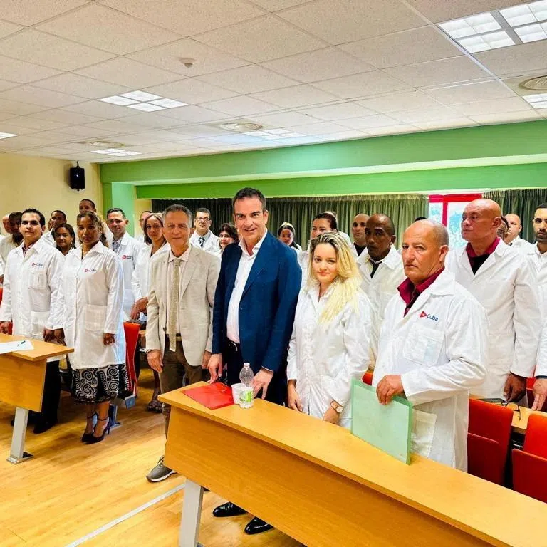 FILE PHOTO: Governor of Italy's Calabria region Roberto Occhiuto poses with Cuban medics whom he has hired to help deal with a shortage of staff in local hospitals, at the University of Calabria in Cosenza, Italy, in this undated picture obtained by Reuters on October 3, 2023. Calabria Region Press Office/Handout via REUTERS/File Photo