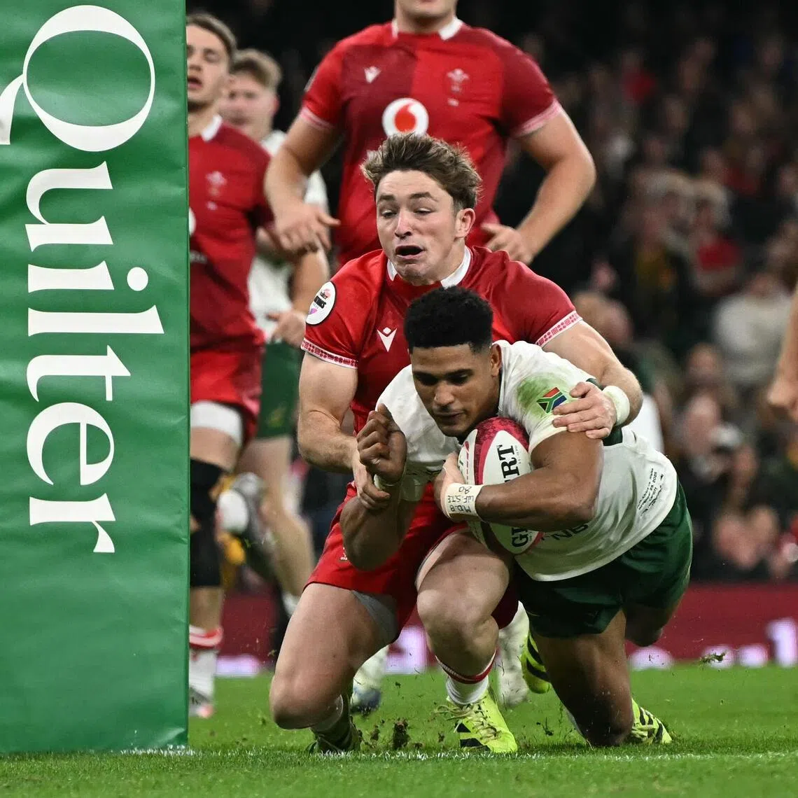 South Africa fly-half Sacha Feinberg-Mngomezulu diving over the line to score a try during the 73-0 Autumn Nations Series International rugby union Test match win over Wales at the Millennium Stadium in Cardiff on Nov 29, 2025.