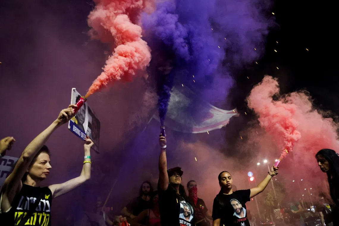 People marching through the streets of Tel Aviv as they attend a protest against the government and to show support for the hostages who were kidnapped during the deadly Oct 7 attack by Hamas.     