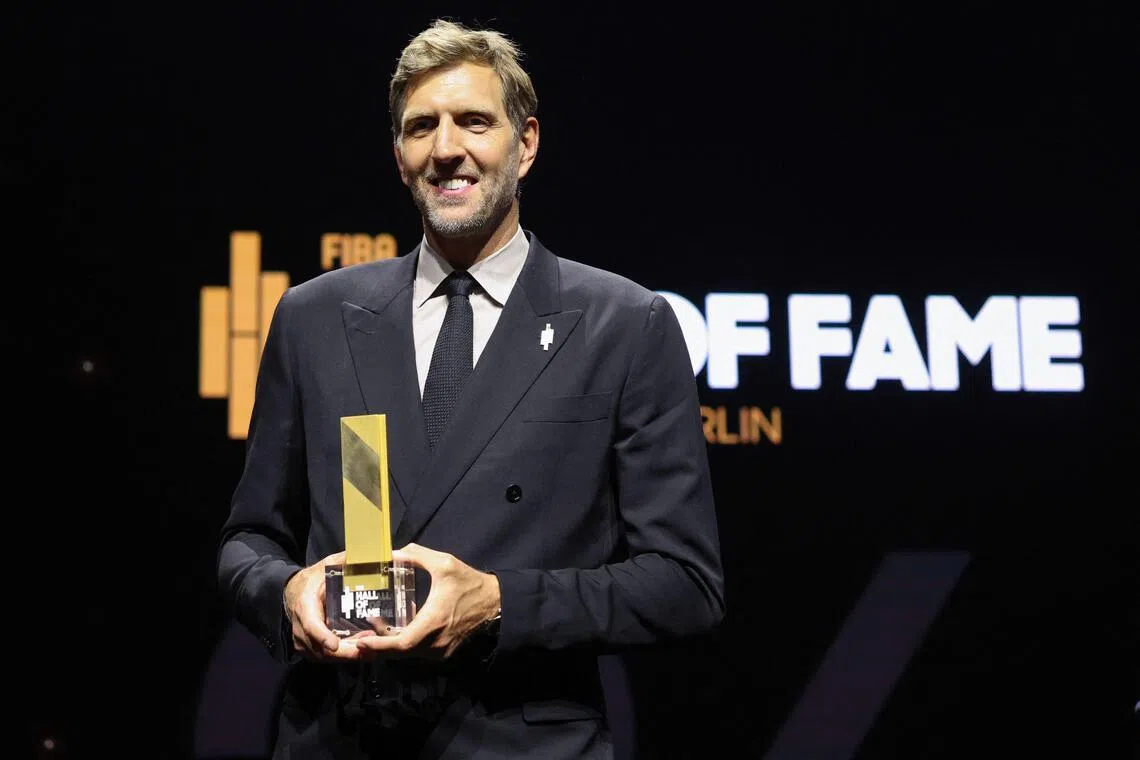 German former basketball player Dirk Nowitzki poses with his award at the International Basketball Federation FIBA Hall of Fame 2026 Induction ceremony in Berlin on April 21.