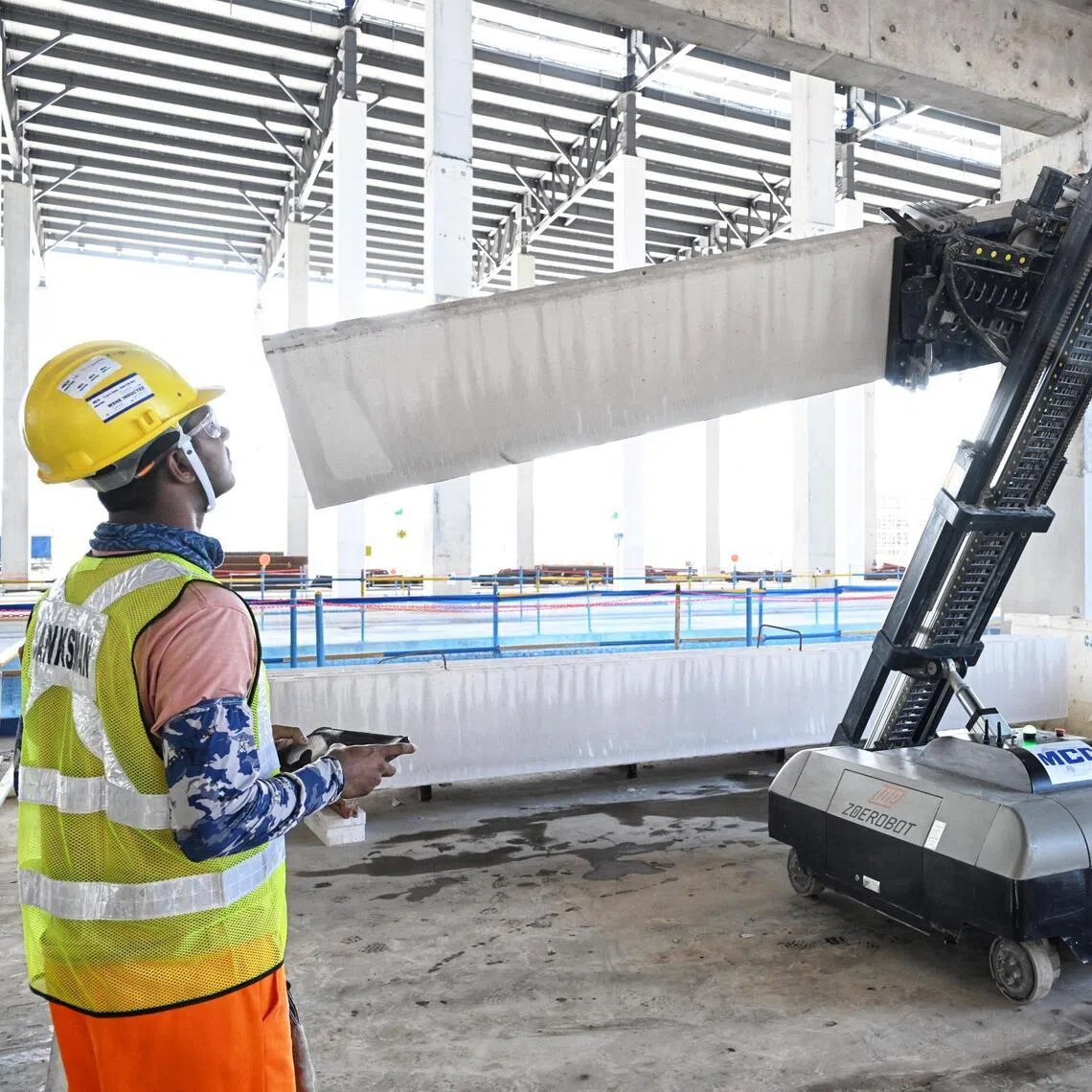 Demonstration of a Autoclaved Lightweight Concrete (ALC) wall panel installation robot seen at the Changi East Depot construction site on May 20.