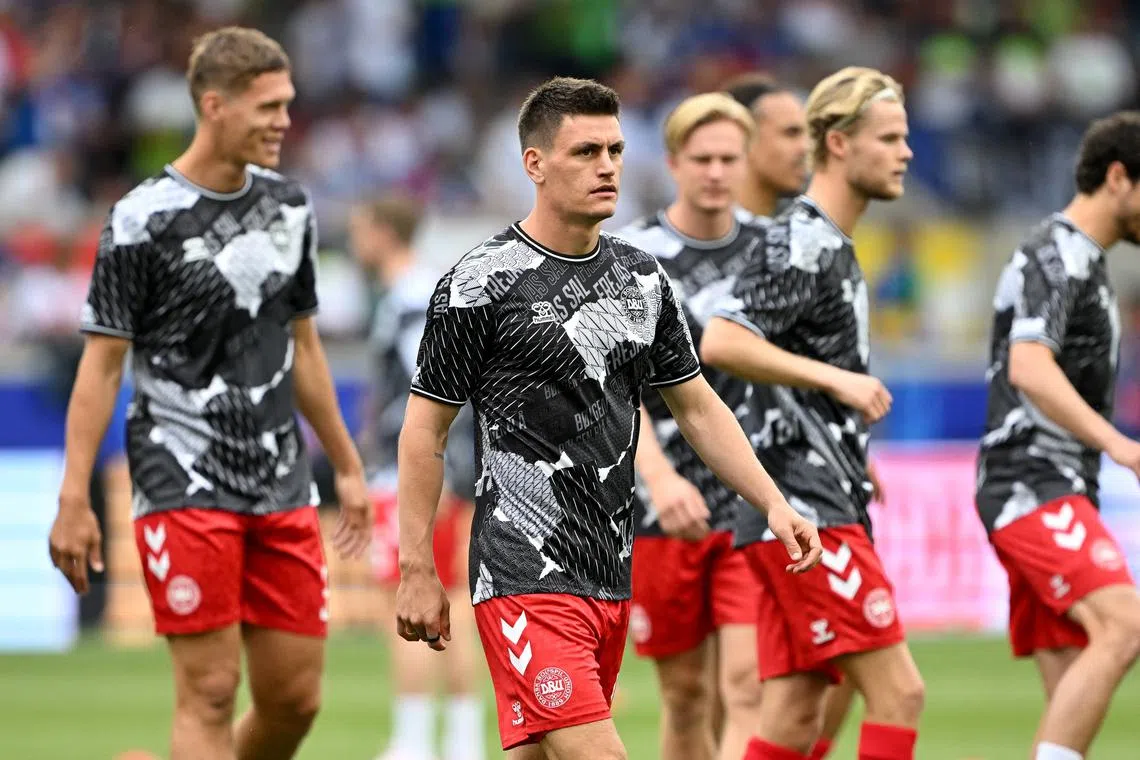 Soccer Football - Euro 2024 - Group C - Slovenia v Denmark - Stuttgart Arena, Stuttgart, Germany - June 16, 2024 Denmark's Joakim Maehle during the warm up before the match REUTERS/Angelika Warmuth