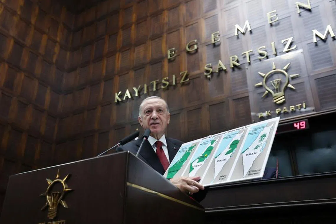 Turkey's President Tayyip Erdogan addresses lawmakers from his ruling AK Party at the Turkish Parliament in Ankara, Turkey October 11, 2023. Murat Cetinmuhurdar/Presidential Press Office/Handout via REUTERS/File Photo