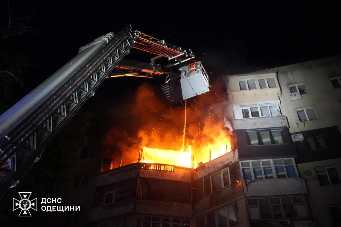A firefighter works at the site of an apartment building hit by Russian drone strike, amid Russia's attack on Ukraine, in Odesa, Ukraine July 3, 2025. Press service of the State Emergency Service of Ukraine in Odesa region/Handout via REUTERS