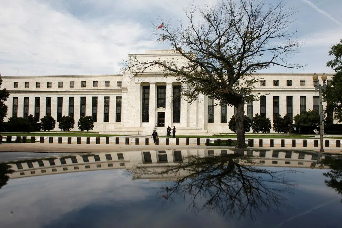 FILE PHOTO: The Federal Reserve Building is reflected on a car in Washington September 16, 2008.  REUTERS/Jim Young /File Photo