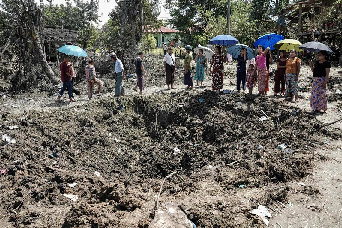 People inspect the damage after bombardments carried out by Myanmar's military in Mrauk U, Myanmar's Rakhine State on Aug 26, 2025.