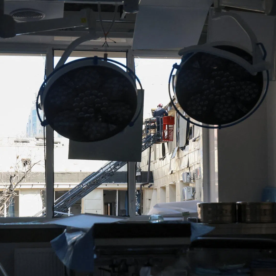 A rescuer works at the site of a maternity hospital which was hit during overnight Russian drone strikes, amid Russia's attack on Ukraine, in Odesa, Ukraine March 28, 2026. REUTERS/Nina Liashonok