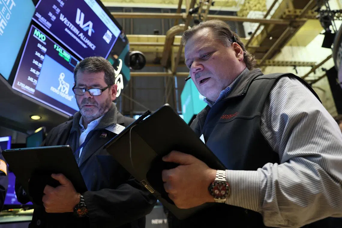 Traders work on the floor of the New York Stock Exchange in New York City.    