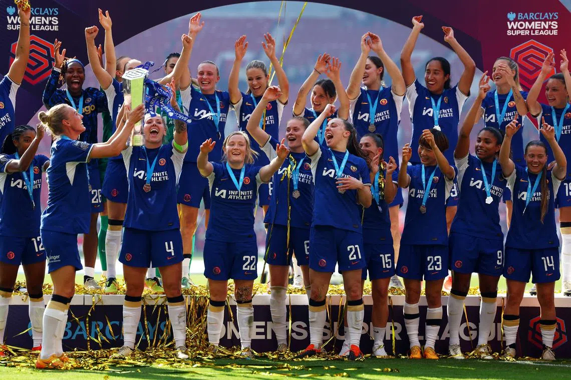 FILE PHOTO: Soccer Football - Women's Super League - Manchester United v Chelsea - Old Trafford, Manchester, Britain - May 18, 2024 Chelsea players celebrate with the trophy after winning the Women's Super League REUTERS/Molly Darlington/File Photo