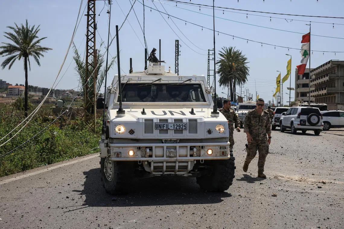 United Nations Interim Force in Lebanon (UNIFIL) peacekeepers and members of the Lebanese army arrive at the site, after an Israeli strike severed the last remaining bridge linking southern Lebanon to the rest of the country, in Qasmiyeh, Lebanon April 16, 2026. REUTERS/Louisa Gouliamaki