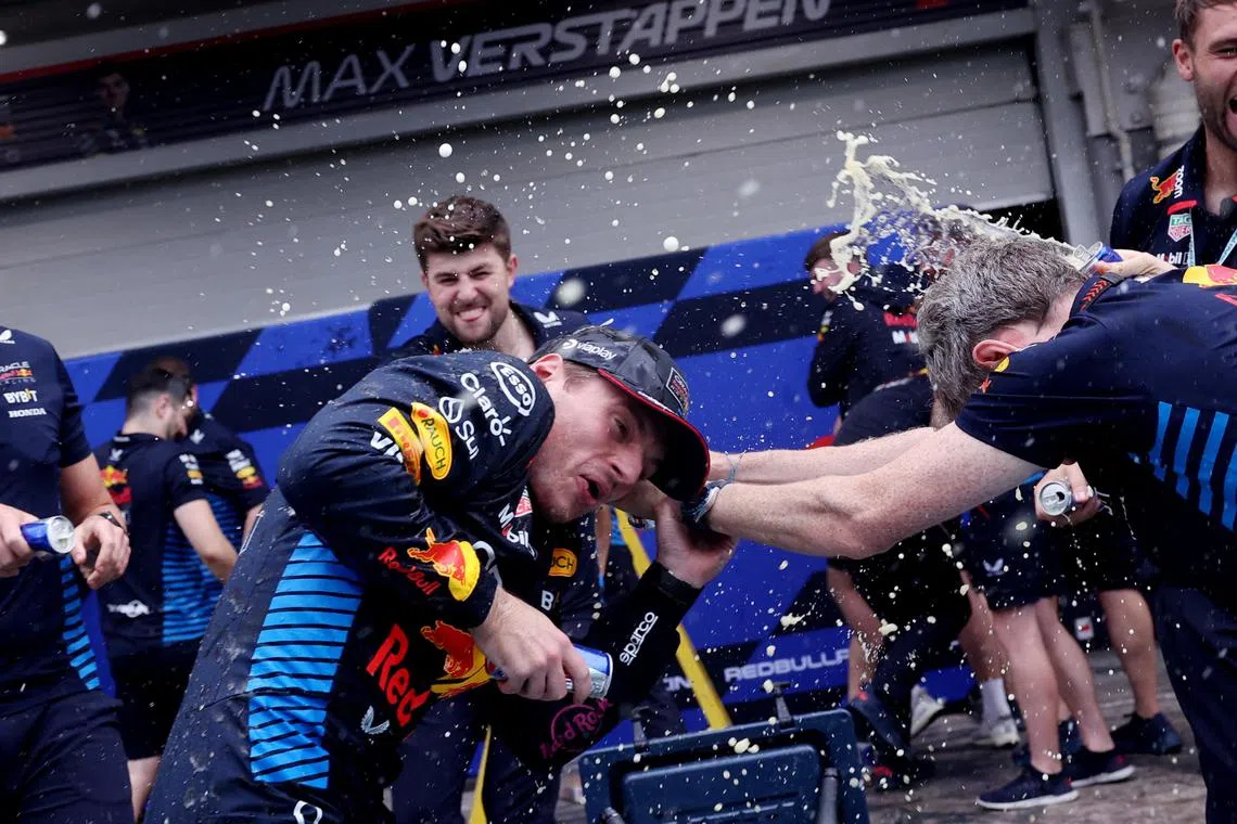 Formula One F1 - Sao Paulo Grand Prix - Autodromo Jose Carlos Pace, Sao Paulo, Brazil - November 3, 2024
Red Bull's Max Verstappen celebrates with teammates after winning the Sao Paulo Grand Prix REUTERS/Amanda Perobelli