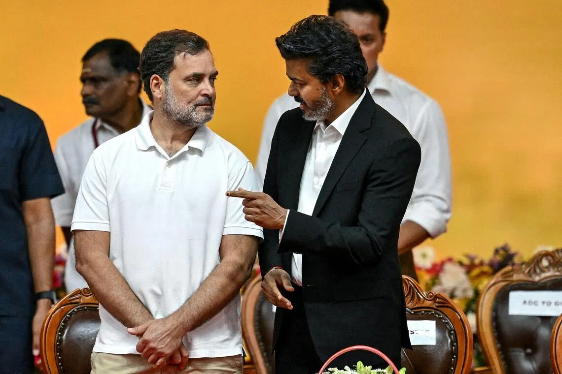 Newly elected chief minister of India's Tamil Nadu state, Mr C. Joseph Vijay (right) speaks with Indian National Congress (INC) party leader Rahul Gandhi on May 10, 2026.  