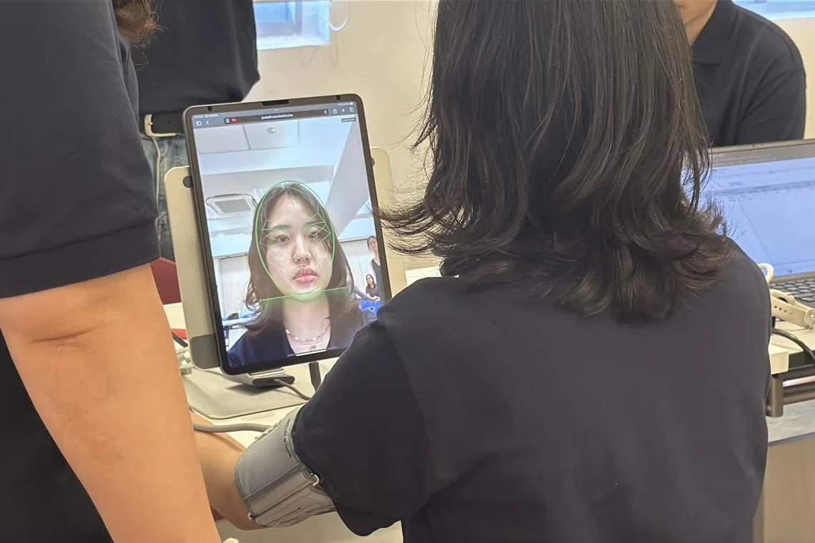 A demonstration of DeepHealthVision, which allows users to take their heart rate and blood pressure with cameras on devices such as phones and tablets.