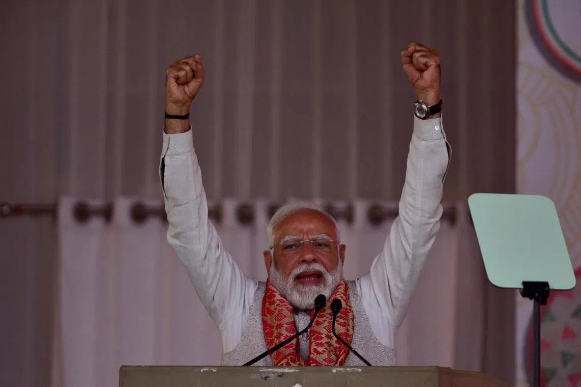 India's Prime Minister Narendra Modi addresses his supporters during a public rally in Guwahati, India, February 14, 2026. REUTERS/Hafiz Ahmed