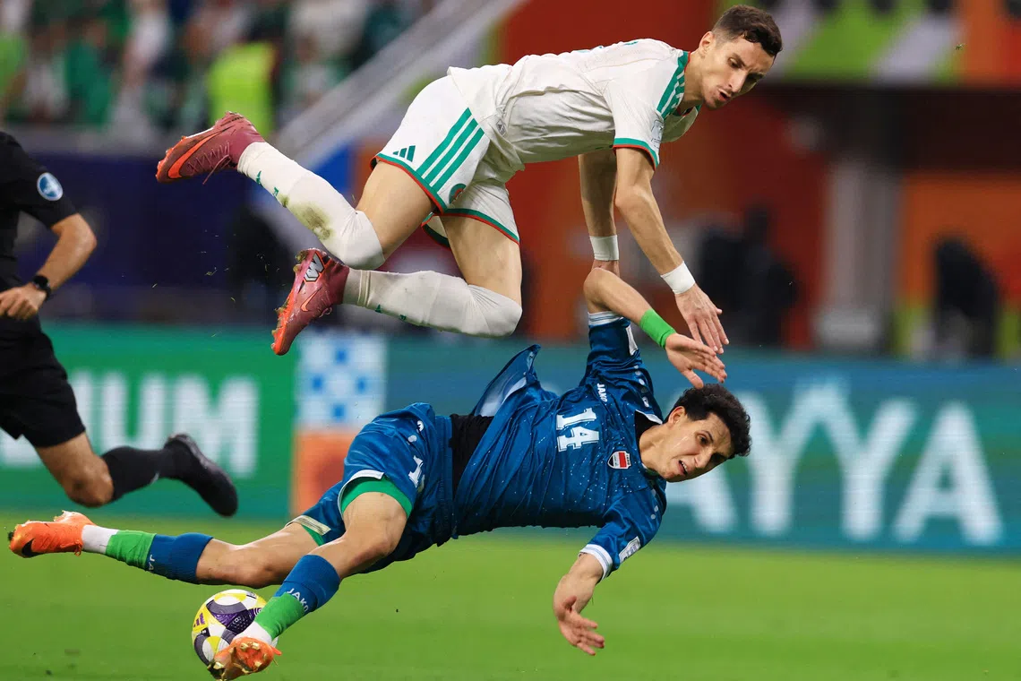 Algeria's Adil Boulbina (top) in action with Iraq's Sajad Jassim at the FIFA Arab Cup - Qatar 2025, Group D match between Algeria and Iraq, held at the Khalifa International Stadium, in Doha, Qatar, on Dec 9, 2025.