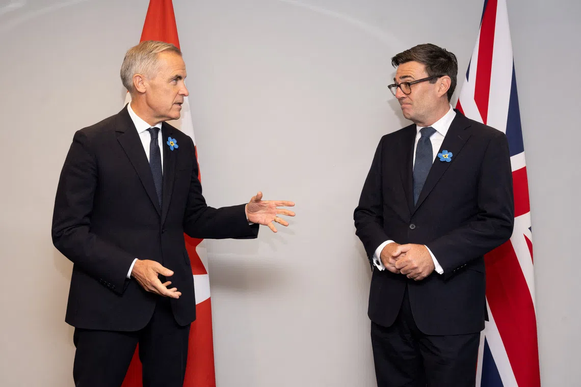 Canadian Prime Minister Mark Carney and British Prime Minister Andy Burnham speak as they attend a bilateral meeting, in Everton, Merseyside, Britain, September 16. 2026. PAUL COOPER/Pool via REUTERS