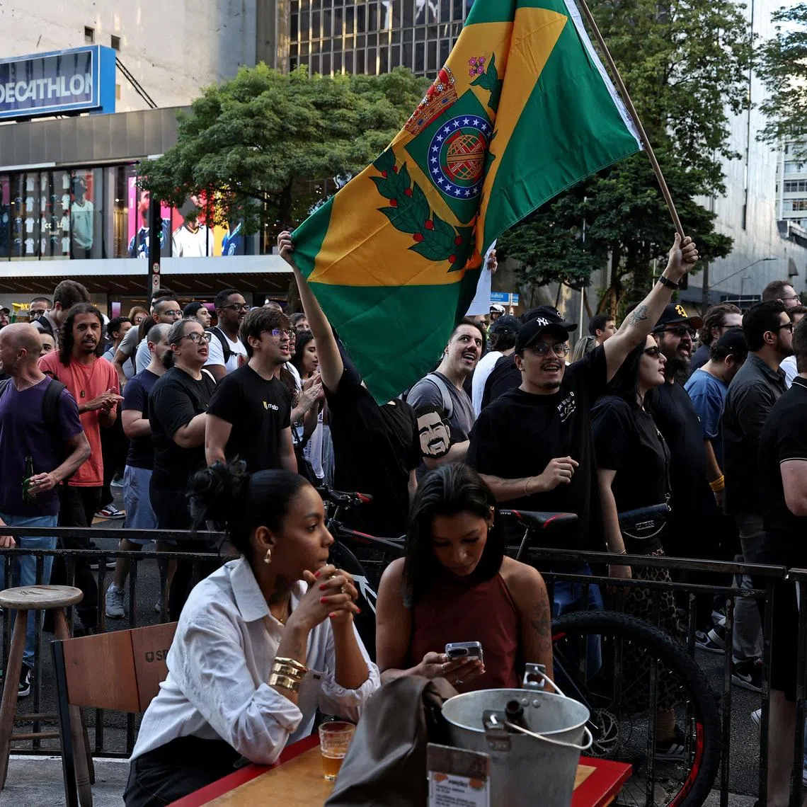 Demonstrators from the right-wing party Missao (Mission in english) and group Movimento Brasil Livre (MBL) hold a flag from the Brazil Monarchy during a protest against corruption and demanding harsher penalties for criminals, in Sao Paulo, Brazil.