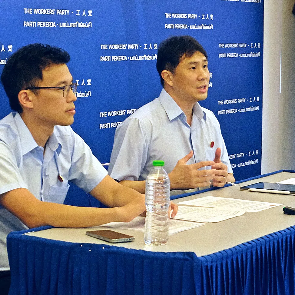 Workers’ Party MPs Kenneth Tiong and Jamus Lim explaining the motion their party will table in Parliament at a press briefing on Aug 1.