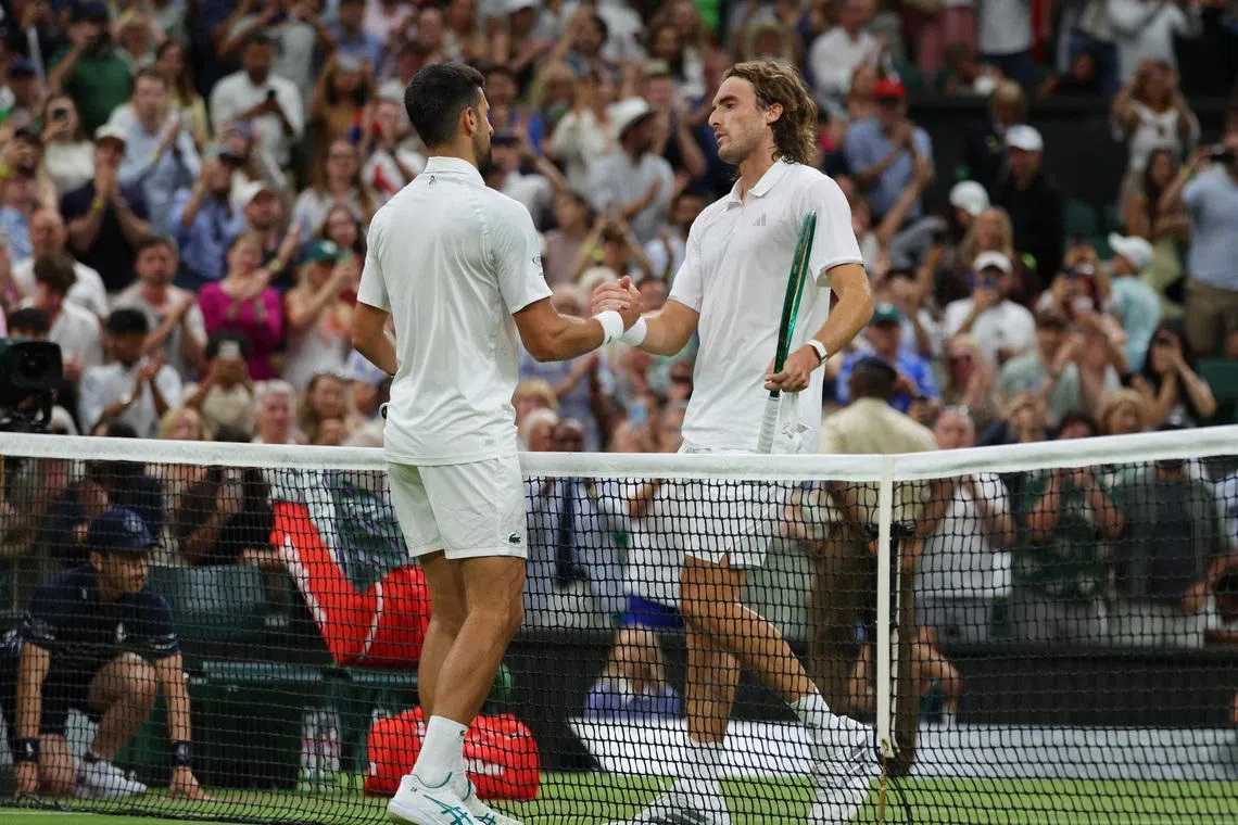 Tennis - Wimbledon - All England Lawn Tennis and Croquet Club, London, Britain - July 1, 2026 Serbia's Novak Djokovic shakes hands with Greece's Stefanos Tsitsipas after winning his second round match REUTERS/Marko Djurica