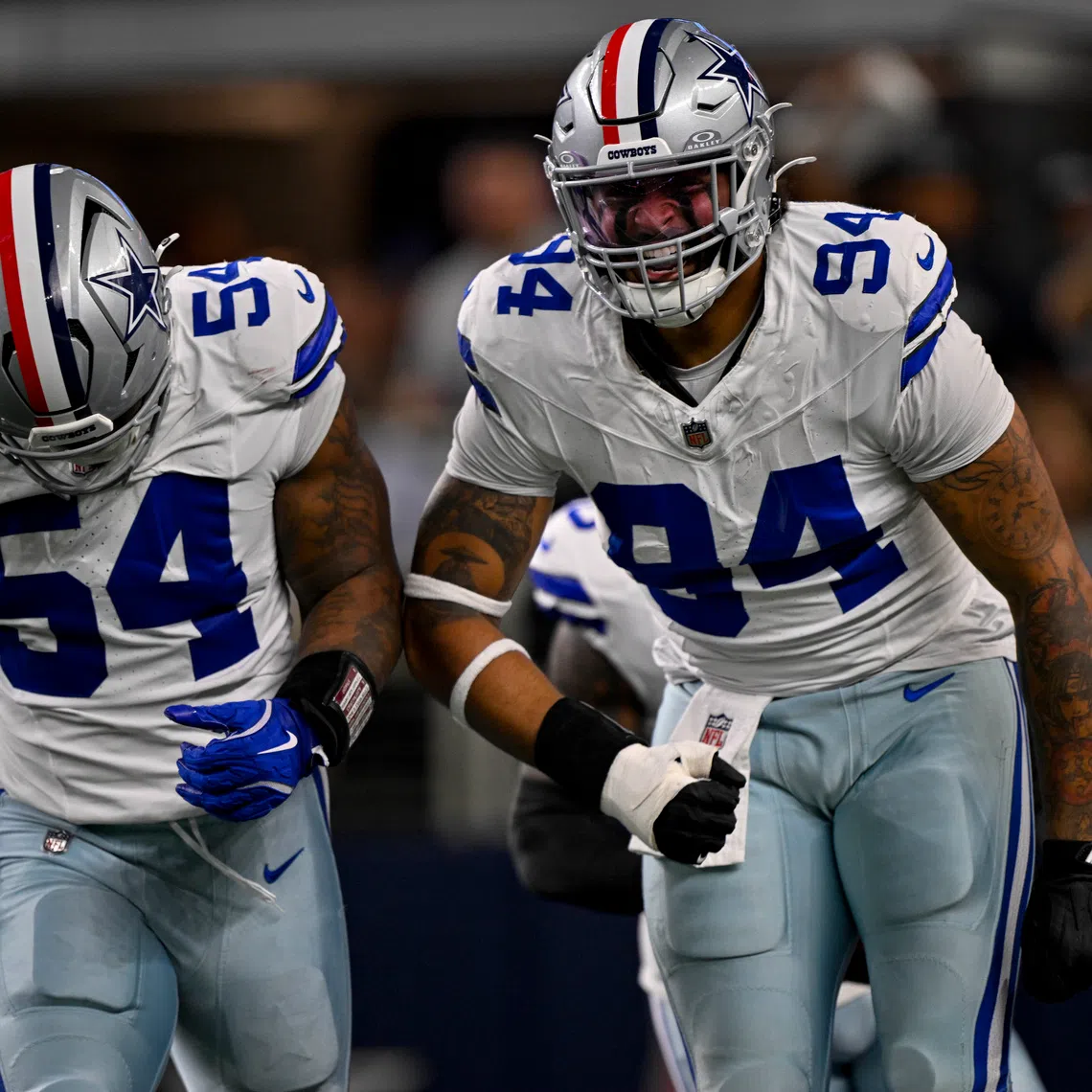 Nov 3, 2025; Arlington, Texas, USA; Dallas Cowboys defensive end Marshawn Kneeland (94) and defensive end Sam Williams (54) celebrates after returning a blocked punt for a touchdown during the game between the Dallas Cowboys and the Arizona Cardinals at AT&T Stadium. Mandatory Credit: Jerome Miron-Imagn Images