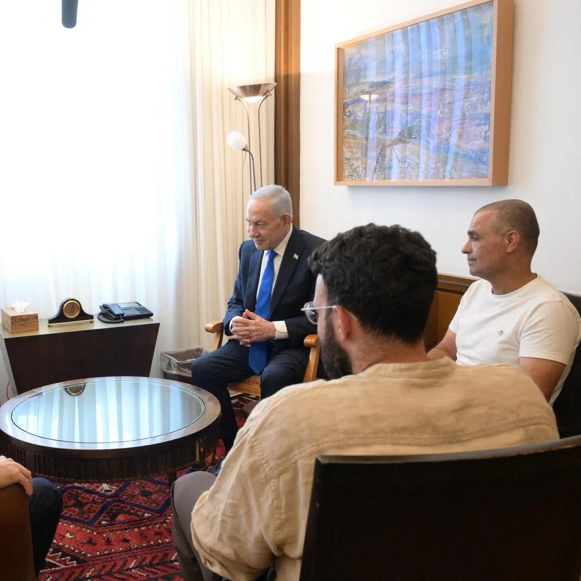 Israeli Prime Minister Benjamin Netanyahu with (clockwise from his left) Yaniv Hayoun, Or Fradilov, dentist Shota Musayev and his wife, Sigalit, whom he described as “heroes”, in Jerusalem on Oct 1.