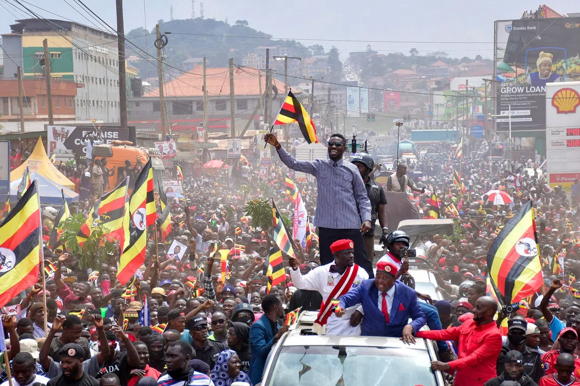Ugandan Presidential candidate Robert Kyagulanyi, also known as Bobi Wine, of the National Unity Platform (NUP) party, waves to supporters as he campaigns ahead of the general elections in Kampala, Uganda. REUTERS/Abubaker Lubowa