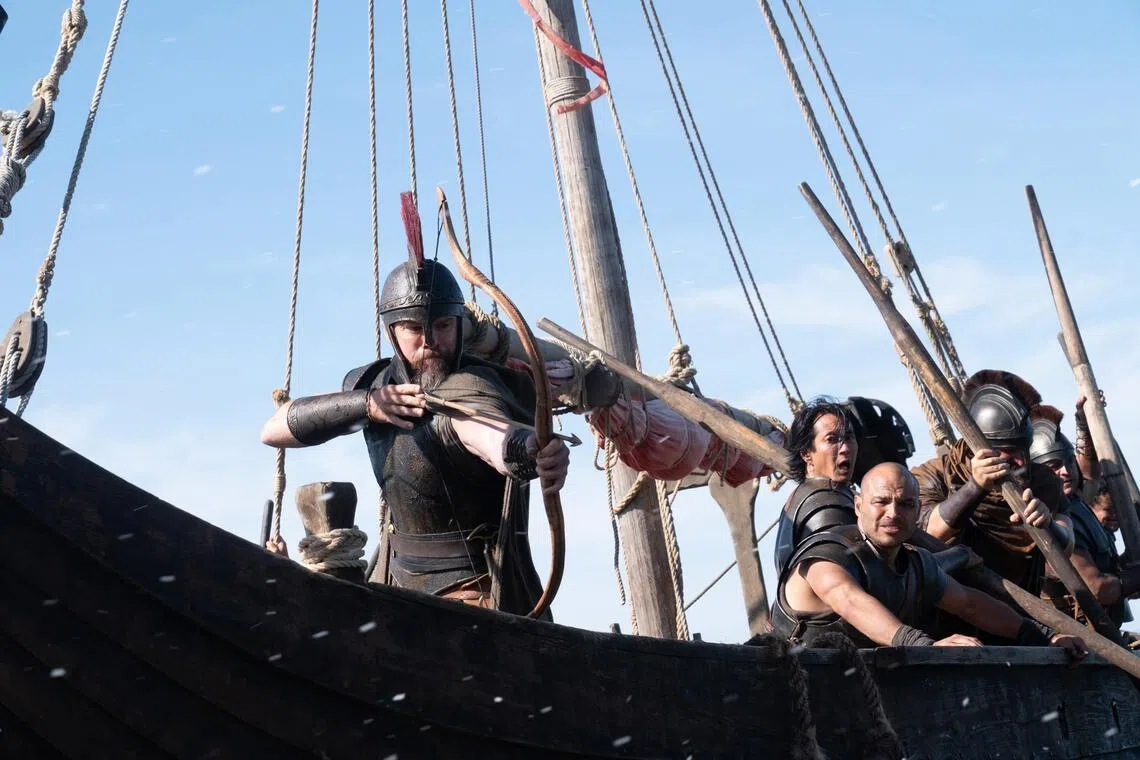 Actor Matt Damon (left, with bow) is Odysseus in The Odyssey.