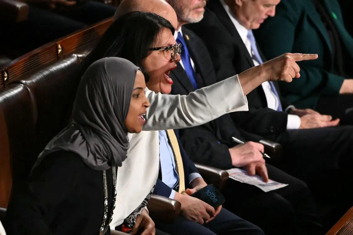 (left to right) US representatives Ilhan Omar and Rashida Tlaib  criticised Mr Trump as he touted his administration’s hardline immigration crackdown and its immigration enforcement actions.