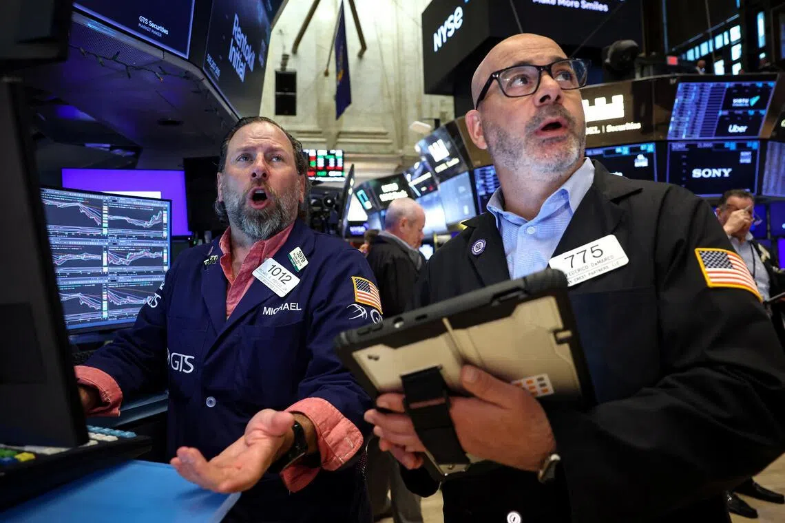 Traders working on the floor of the New York Stock Exchange, in New York City, on June 8.   