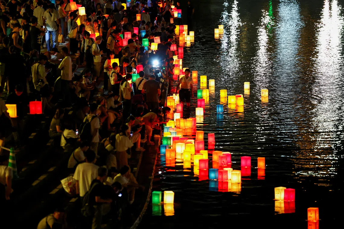 People release paper lanterns on the Motoyasu River in remembrance of atomic bomb victims, marking the 81st anniversary of the atomic bombing, in Hiroshima, western Japan, August 6, 2026. REUTERS/Issei Kato     TPX IMAGES OF THE DAY