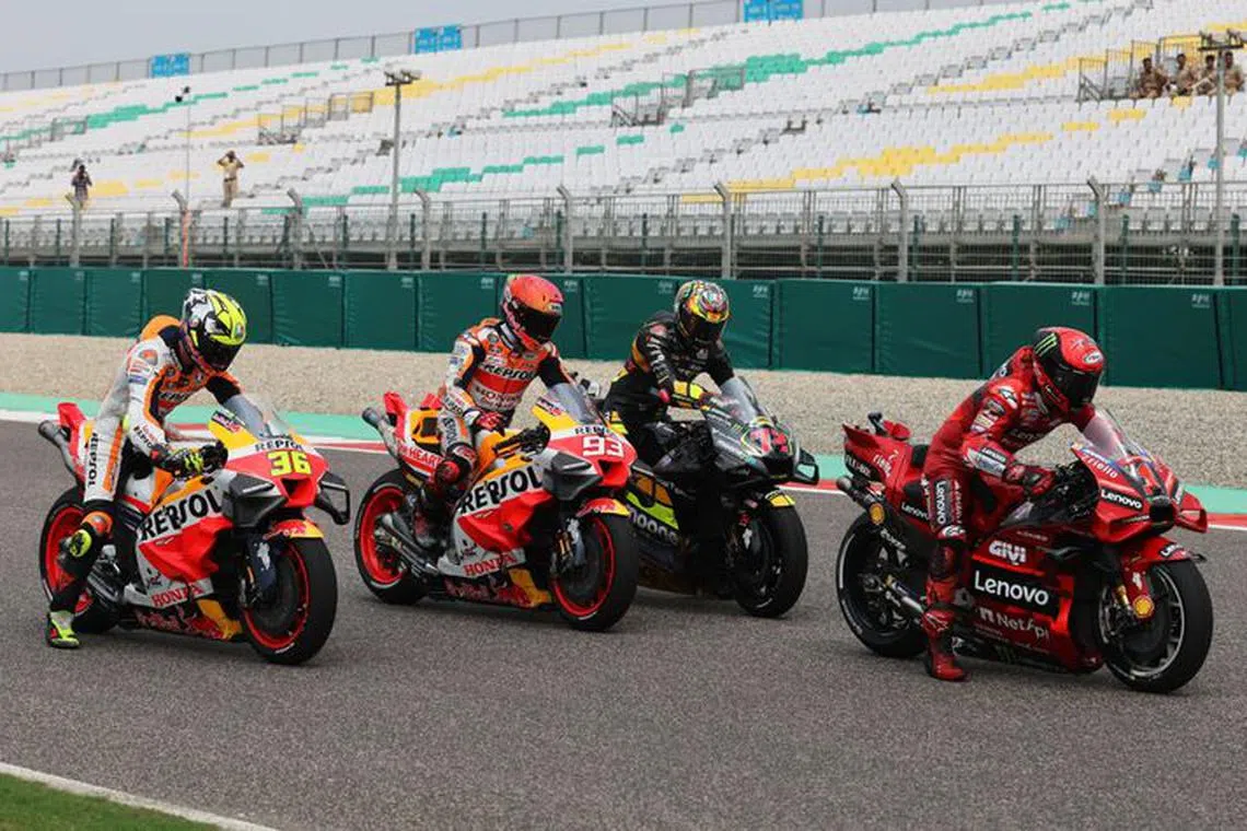 FILE PHOTO: MotoGP - Indian Grand Prix - Buddh International Circuit, Greater Noida, India - September 23, 2023 Repsol Honda Team's Joan Mir, Repsol Honda Team's Marc Marquez, Mooney VR46 Racing Team's Marco Bezzecchi and Ducati Lenovo Team's Francesco Bagnaia after qualifying REUTERS/Anushree Fadnavis/File Photo