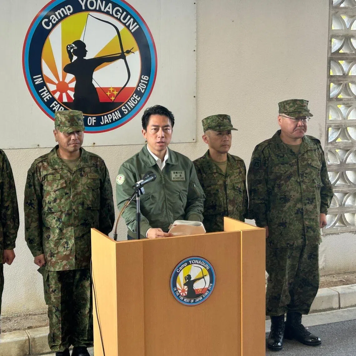 Japan's Defence Minister Shinjiro Koizumi (centre) speaks at the Ground Self-Defence Force base in Yonaguni, Japan, on Nov 23., 2025.