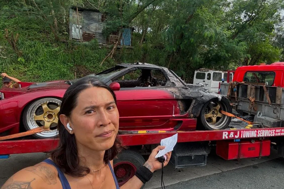 Philippine motorsports influencer Angie Mead King shows the burn out Acura NSX she was featuring in her video blog.  