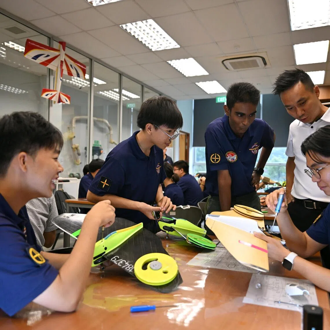 Singapore Youth Flying Club, 2026 FAI F2 World Championship for Control Line Model Aircraft, Singapore Junior Team 

(From left) Melvin Tan, 18, Ethan lok, 14, Moovendra Vickineswaran, 15,  Mr Kevin Su, and Daryl Chow, 19,  at Singapore Youth Flying Club on May 23, 2026.