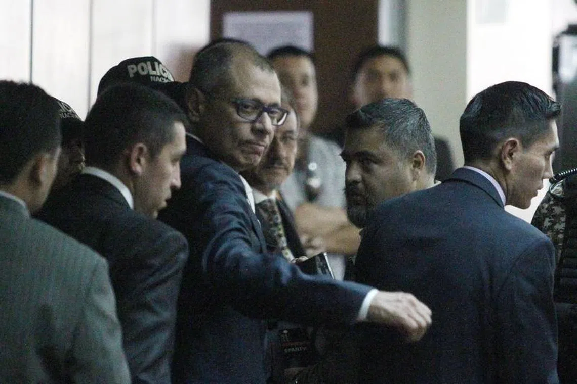 Ecuadorean Vice President Jorge Glas reacts as he arrives to court, to attend his trial on bribery from Brazilian construction company Odebrecht, in Quito, Ecuador, December 13, 2017. REUTERS/Daniel Tapia/File Photo