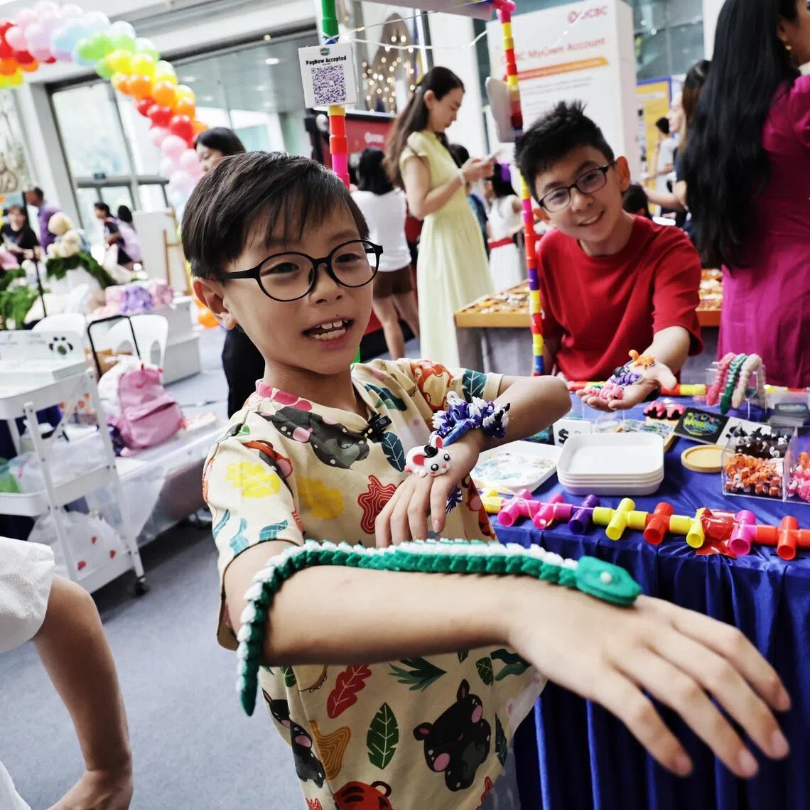 Lee Rui Qi with his 3D-printed animal figurines at Singapore Kidpreneurs at HarbourFront Centre.