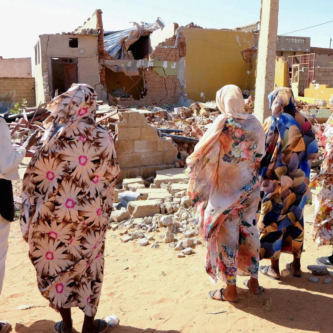 FILE PHOTO: People pray for the victims of a drone strike in El Obeid, North Kordofan State, Sudan, January 12, 2026. REUTERS/El Tayeb Siddig/File Photo