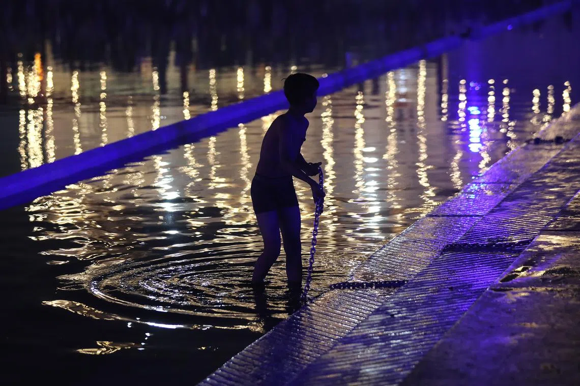 A devotee taking a dip inside the sacred pond at the Gurudwara Bangla Sahib on the occasion of the birth anniversary of Sri Guru Nanak Dev Ji, the first Sikh Guru in New Delhi, India, on Nov 27, 2023. 