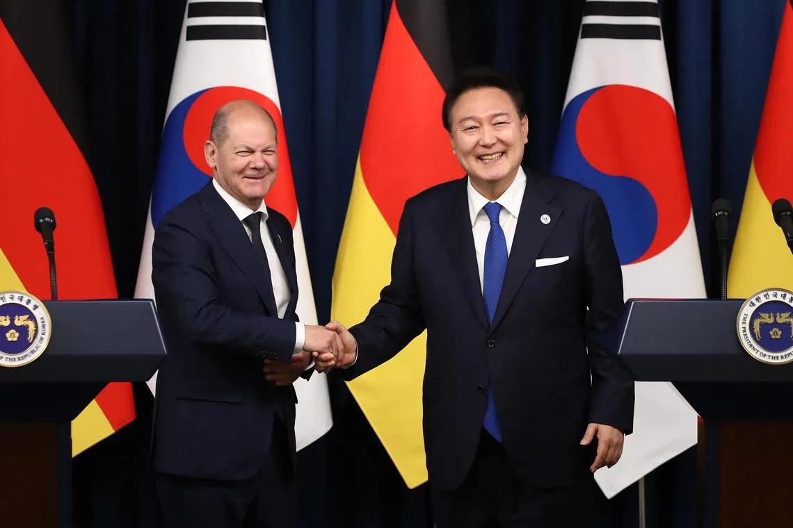 epa10643449 German Chancellor Olaf Scholz (L) shakes hands with South Korea’s President Yoon Suk Yeol (R) after their joint press conference at the Presidential Office in Seoul, South Korea, 21 May 2023. Olaf Scholz arrived in Seoul on 21 May for the summit with Yoon after attending a G7 summit in Hiroshima, Japan.  EPA-EFE/Chung Sung-Jun / POOL