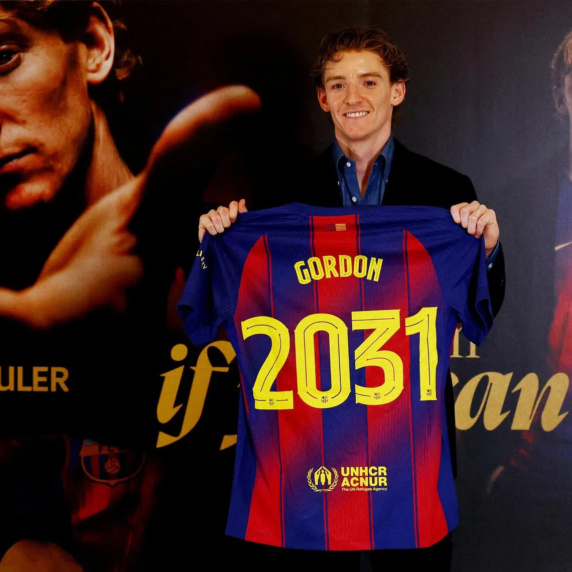 Soccer Football - Anthony Gordon signs for FC Barcelona - Spotify Camp Nou, Barcelona, Spain - May 29, 2026 Anthony Gordon poses as he holds a shirt after signing for FC Barcelona REUTERS/Albert Gea