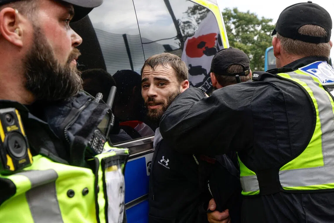 Anti-migrant activists, counter-protesters face off in flashpoint UK city