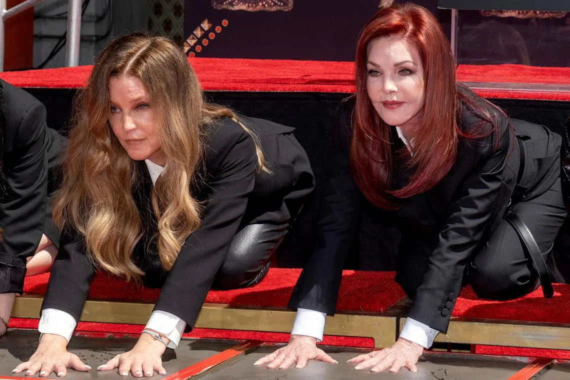 FILE PHOTO: Lisa Marie Presley and her mother Priscilla Presley place their handprints in cement at TCL Chinese theatre in Los Angeles, California, U.S. June 21, 2022. REUTERS/Ringo Chiu/File Photo